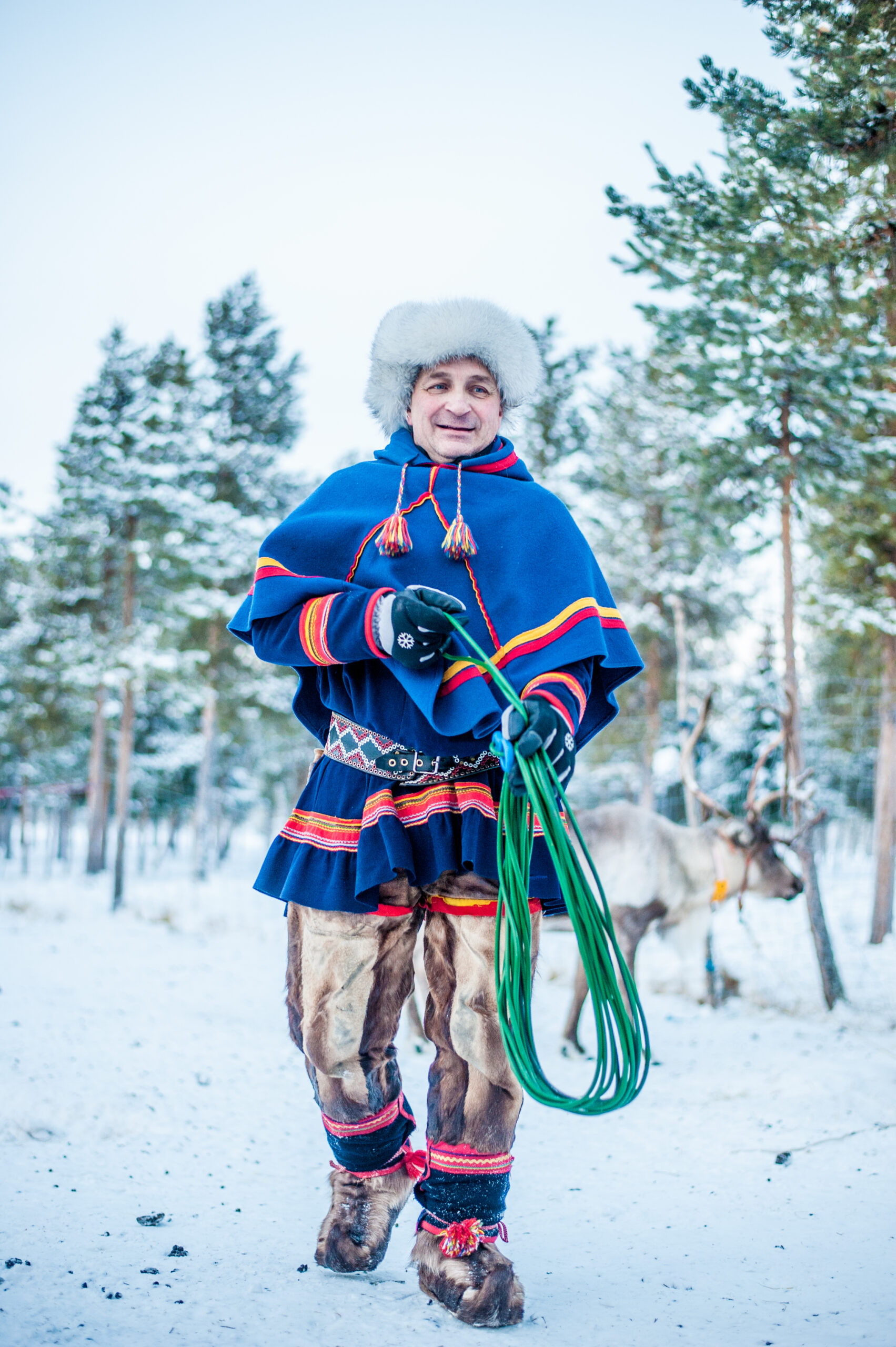 Sami man with lasso and traditional clothes
